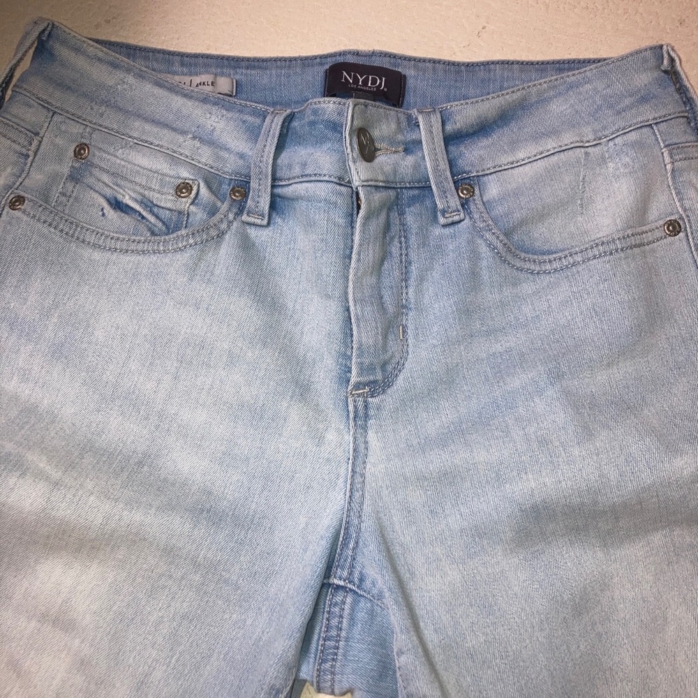 NYDJ SIZE 8. Wide trim at cuff light wash jeans